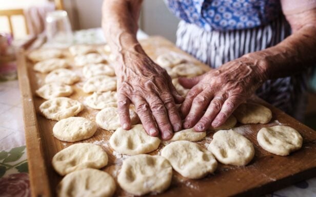 Experienced hands handling dough, one of the activities to experience and learn from during the Cooking tour in Antiparos Greece by Discover Greek Culture